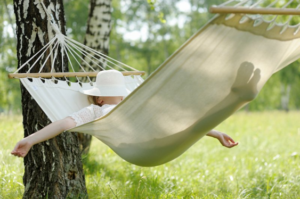 Woman relaxing on a hammock after full mouth reconstruction